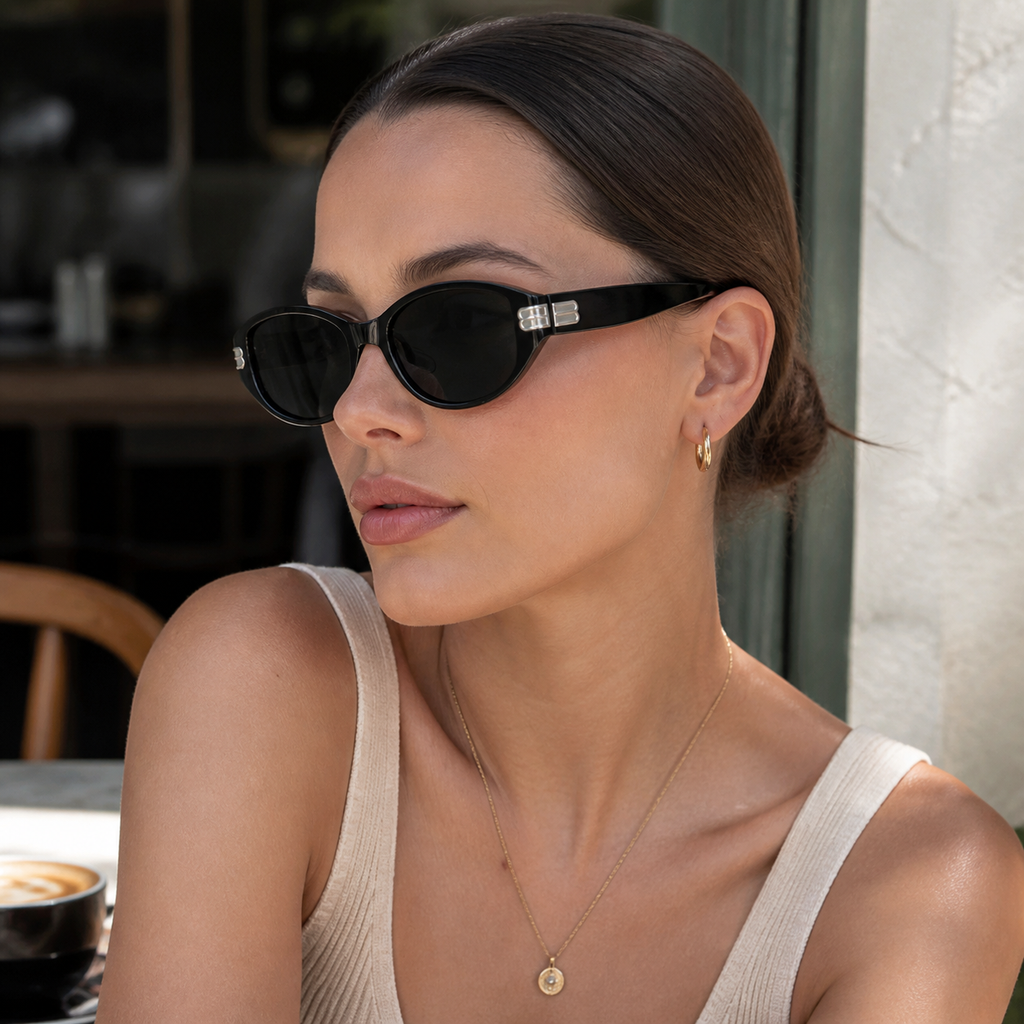 Women’s Matte Black full-rim cat-eye sunglasses, three-quarter adult model fit