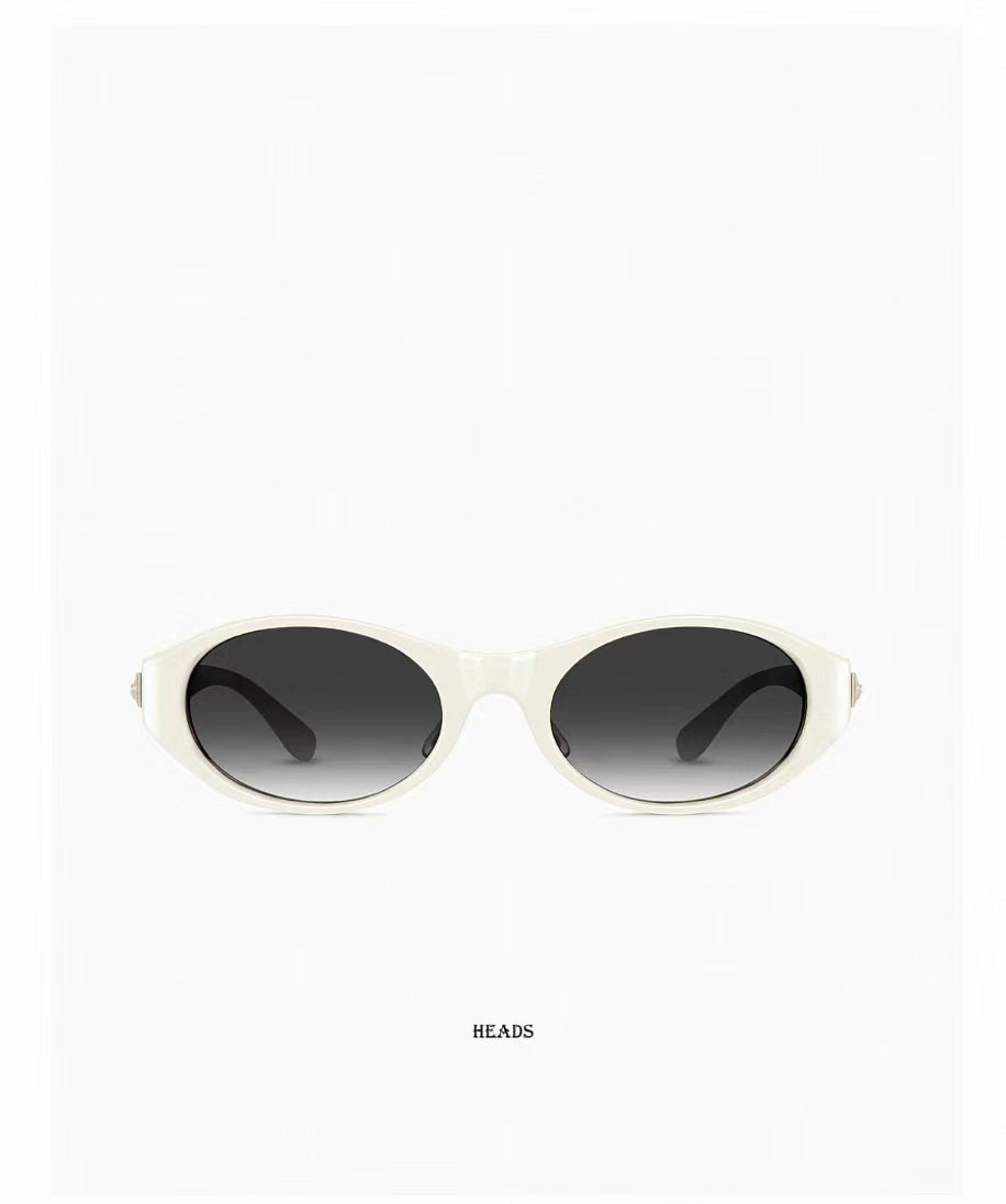 Women’s Ivory full-rim cat-eye sunglasses, front and three-quarter views