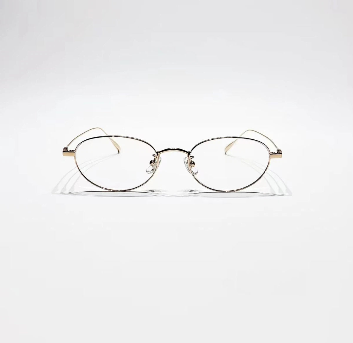 Black & Gold women's titanium small oval full-rim glasses, front product view