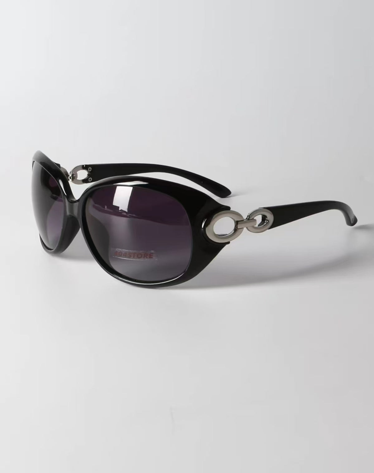 Women’s Black full-rim oversized oval sunglasses, three-quarter view