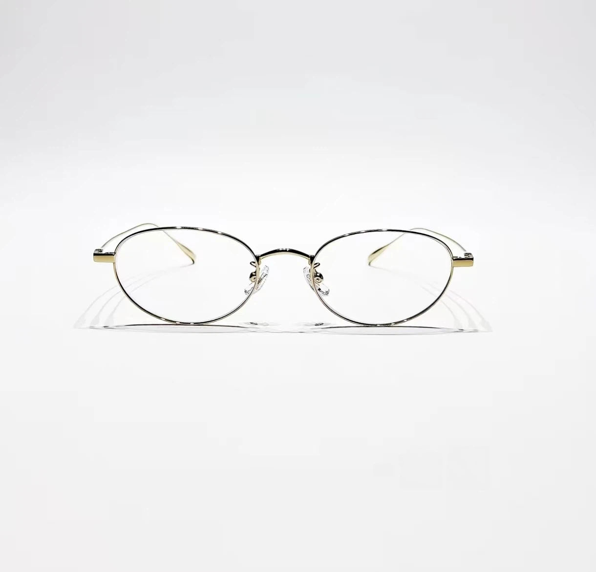 Rose Gold women's titanium small oval full-rim glasses, front product view