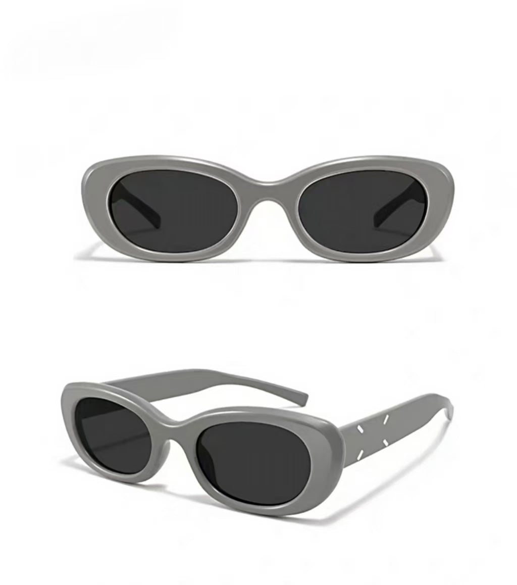 Women’s Gray full-rim narrow cat-eye sunglasses, front and three-quarter views