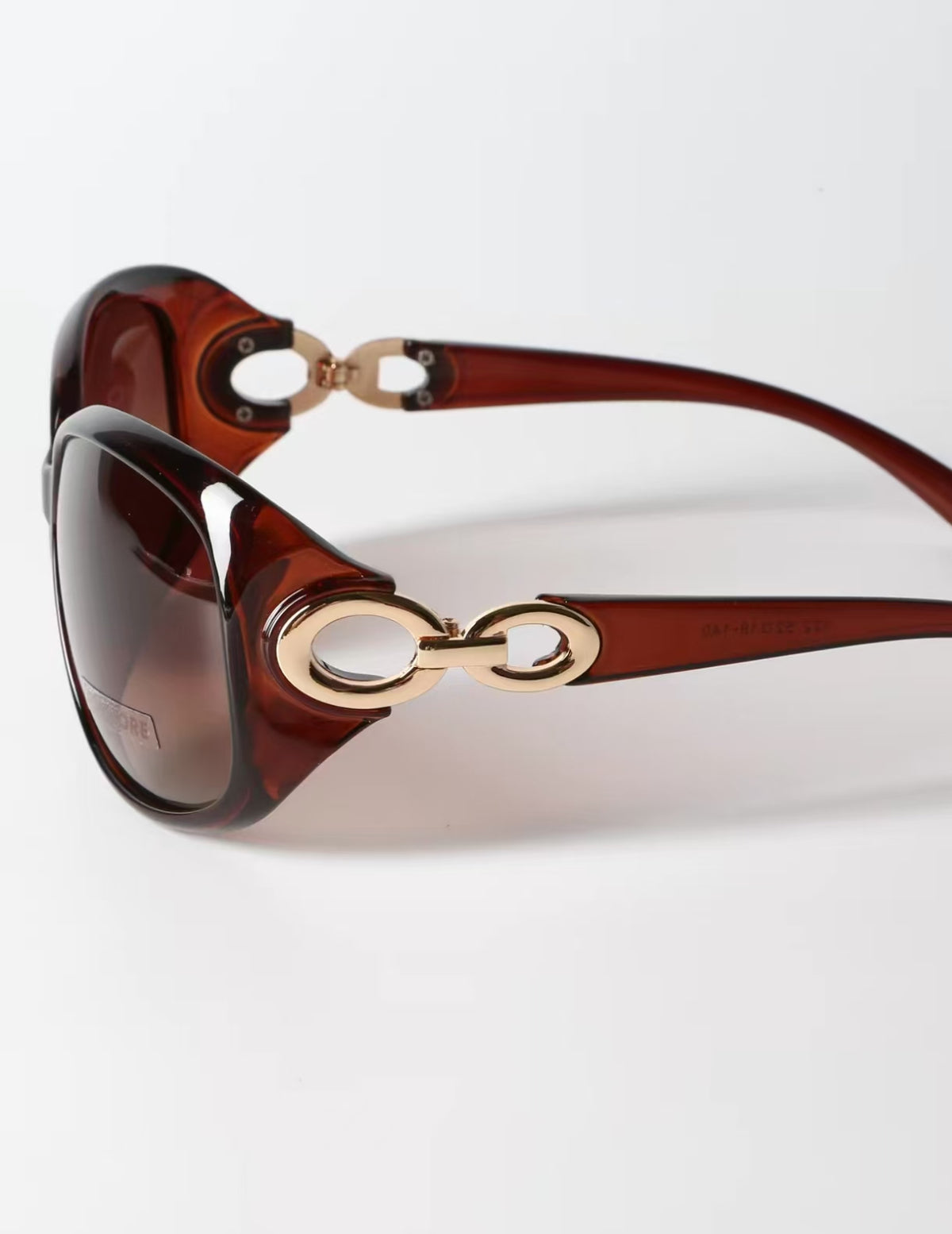 Women’s Amber Brown full-rim oversized oval sunglasses, hinge detail view