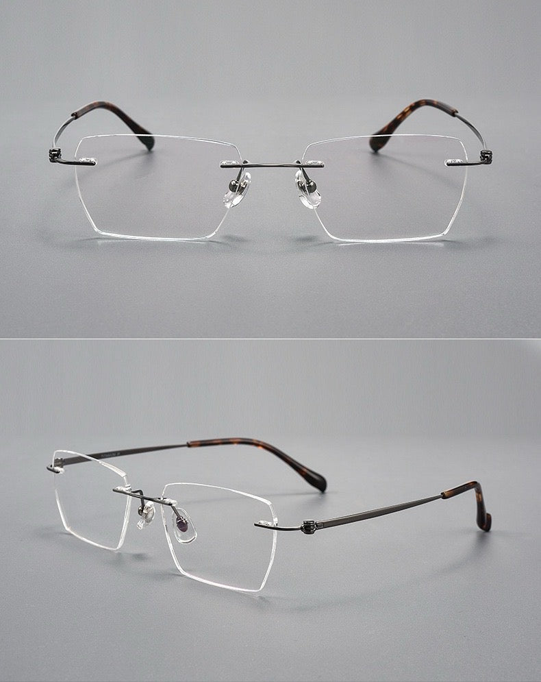 Gunmetal men's pure titanium and lightweight acetate rimless geometric glasses, supplier front and three-quarter views
