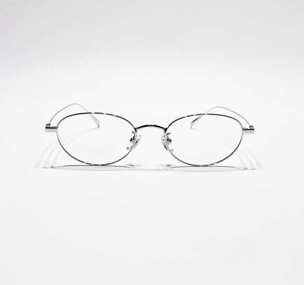 Silver women's titanium small oval full-rim glasses, front product view