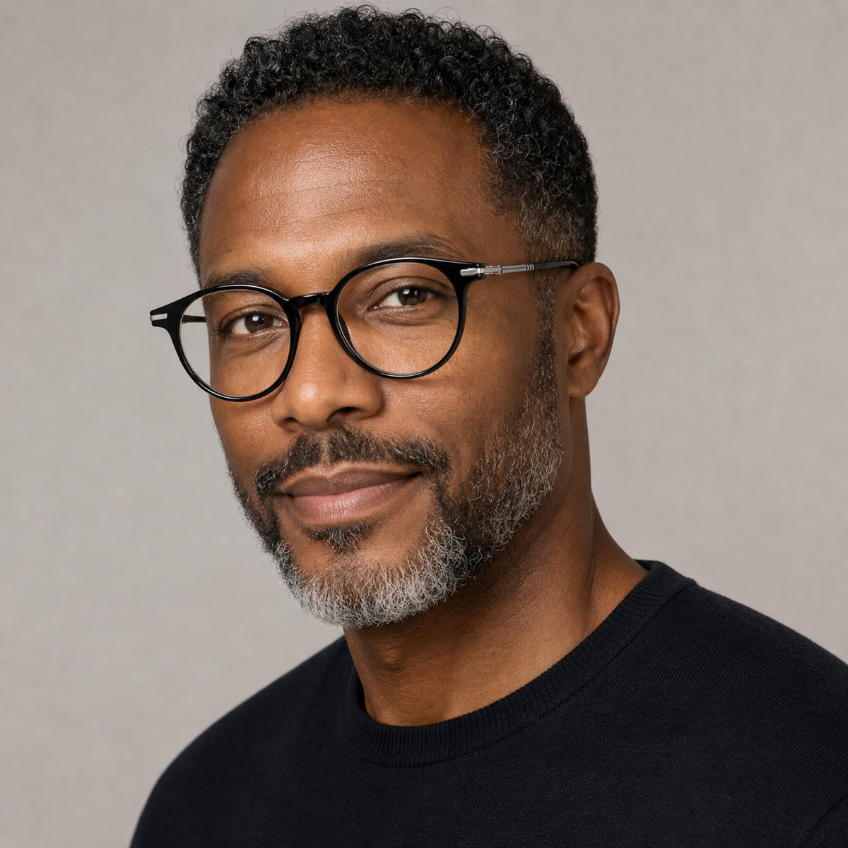 Glossy Black unisex TR90 round full-rim glasses worn by an adult mature Black man