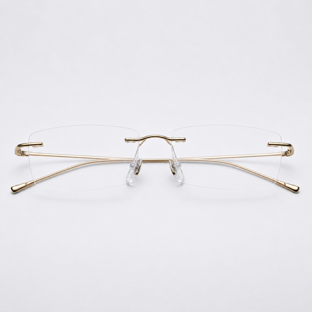 Gold beta-titanium rectangular rimless glasses, front product view