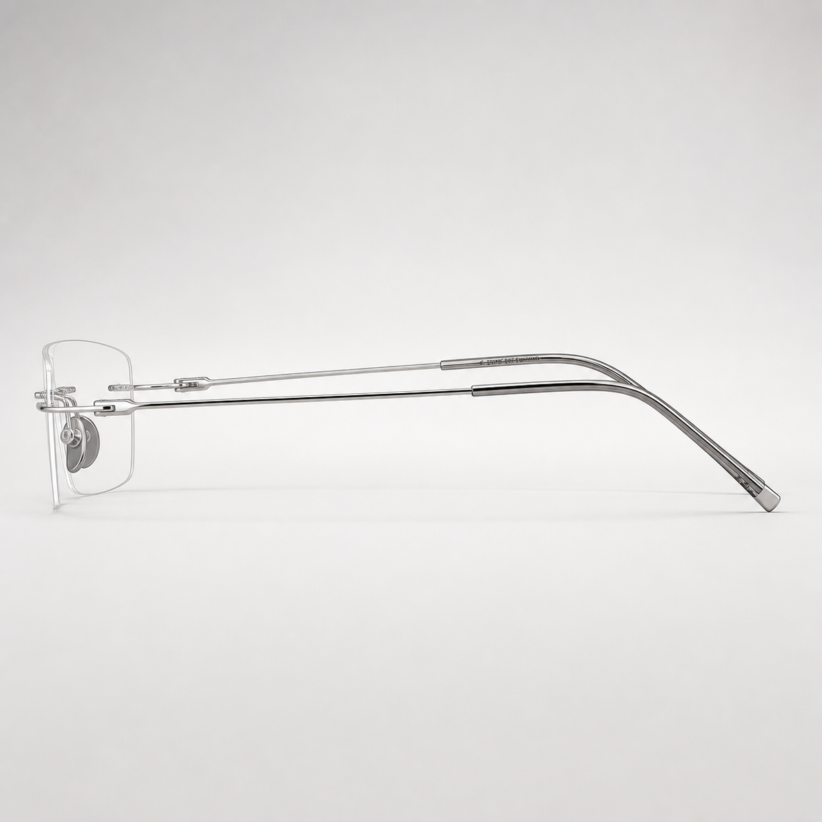 Silver pure titanium rimless shallow rectangular eyeglasses, side-profile product view