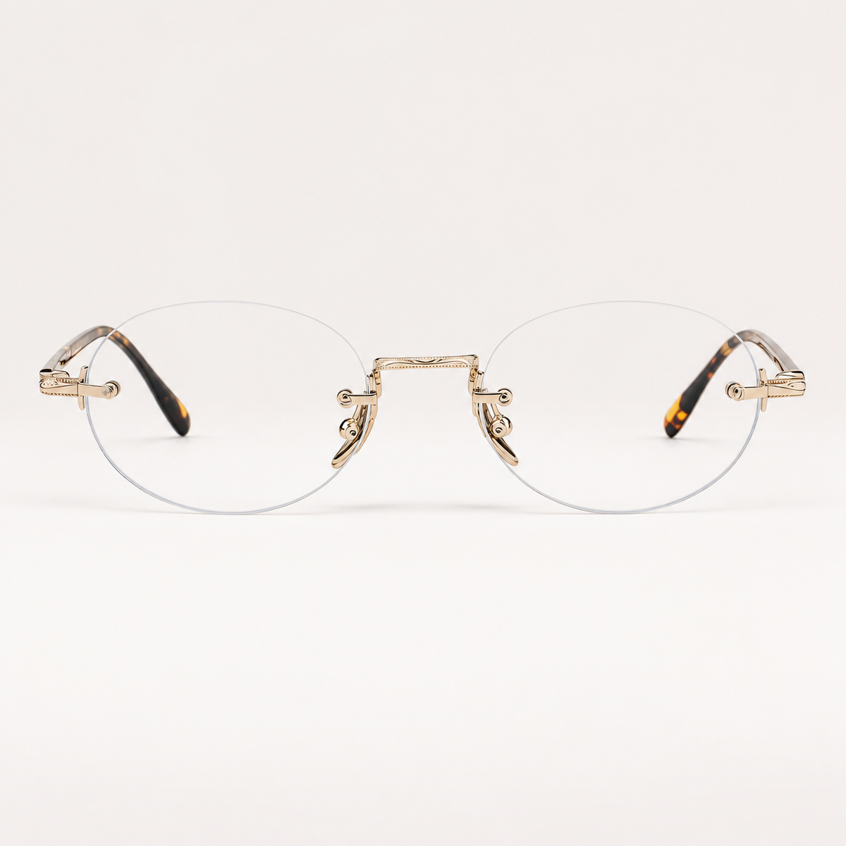 Gold/Tortoise titanium and acetate rimless oval eyeglasses, straight-on product view