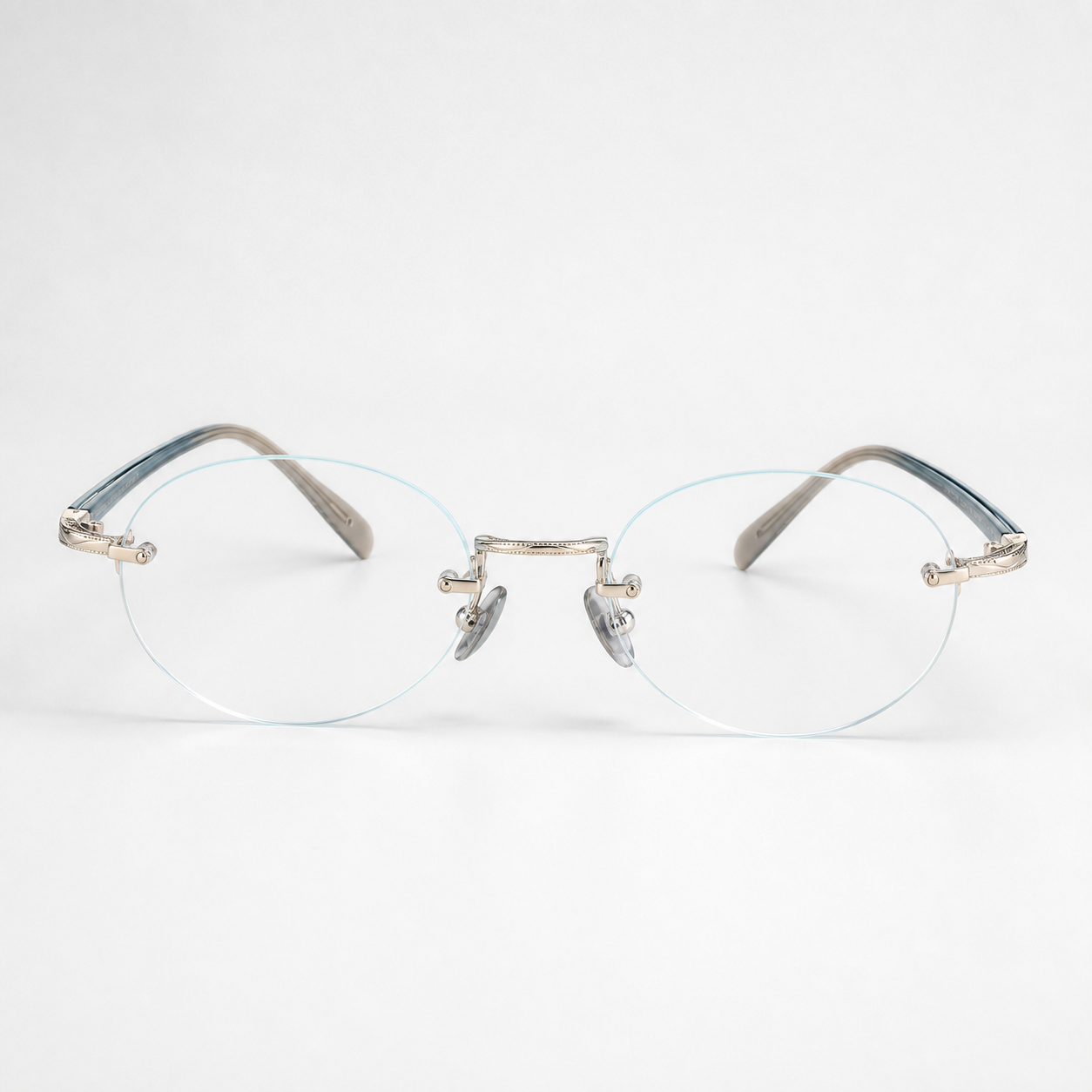 Silver/Blue titanium and acetate rimless oval eyeglasses, straight-on product view