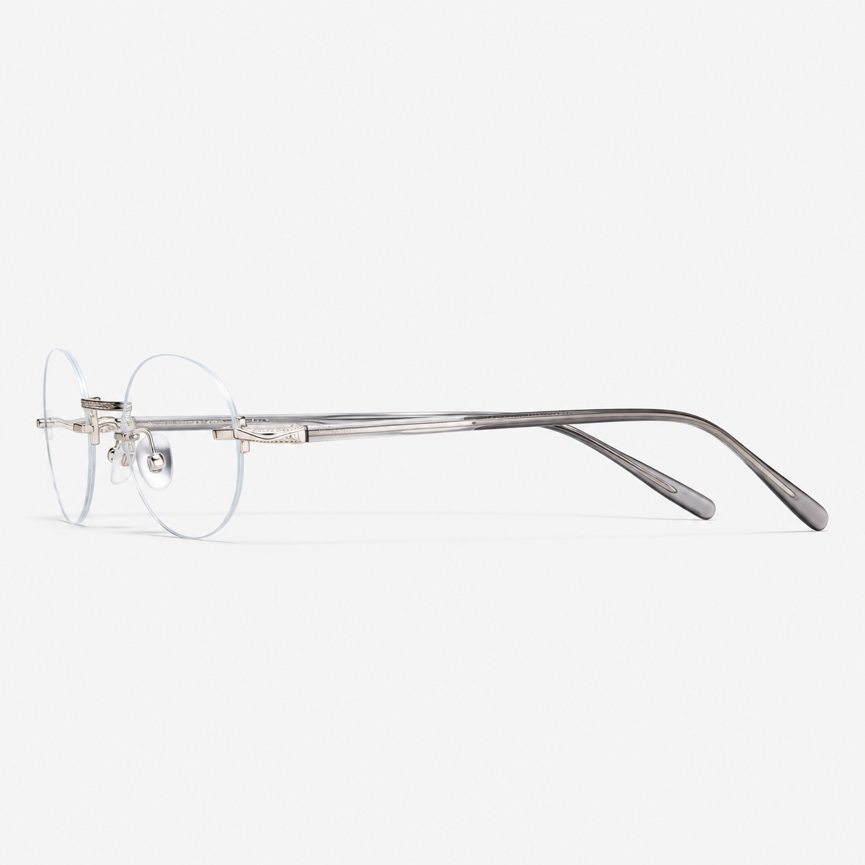 Silver/Grey titanium and acetate rimless oval eyeglasses, side-profile product view