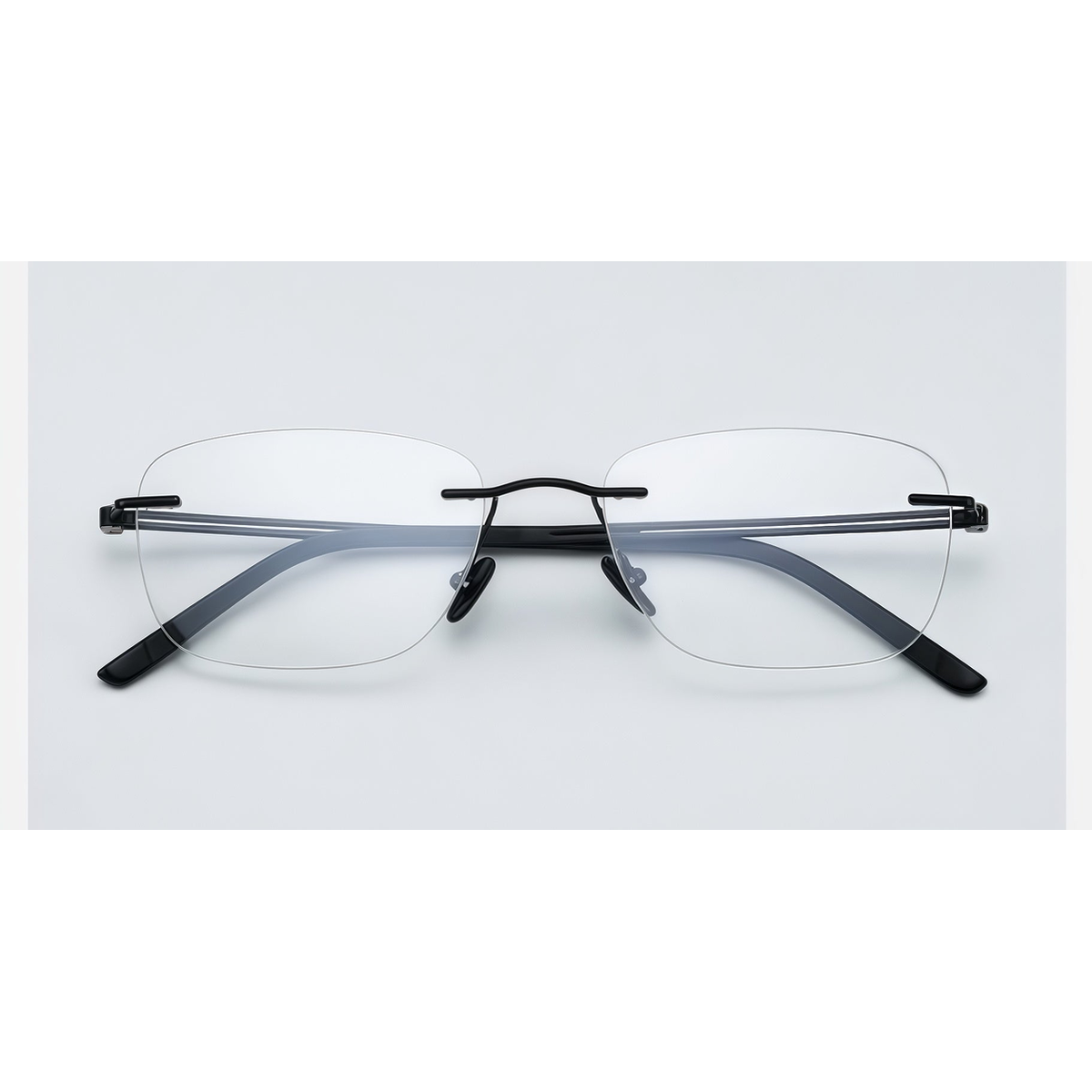 Black men's pure titanium rimless rectangular glasses, front product view
