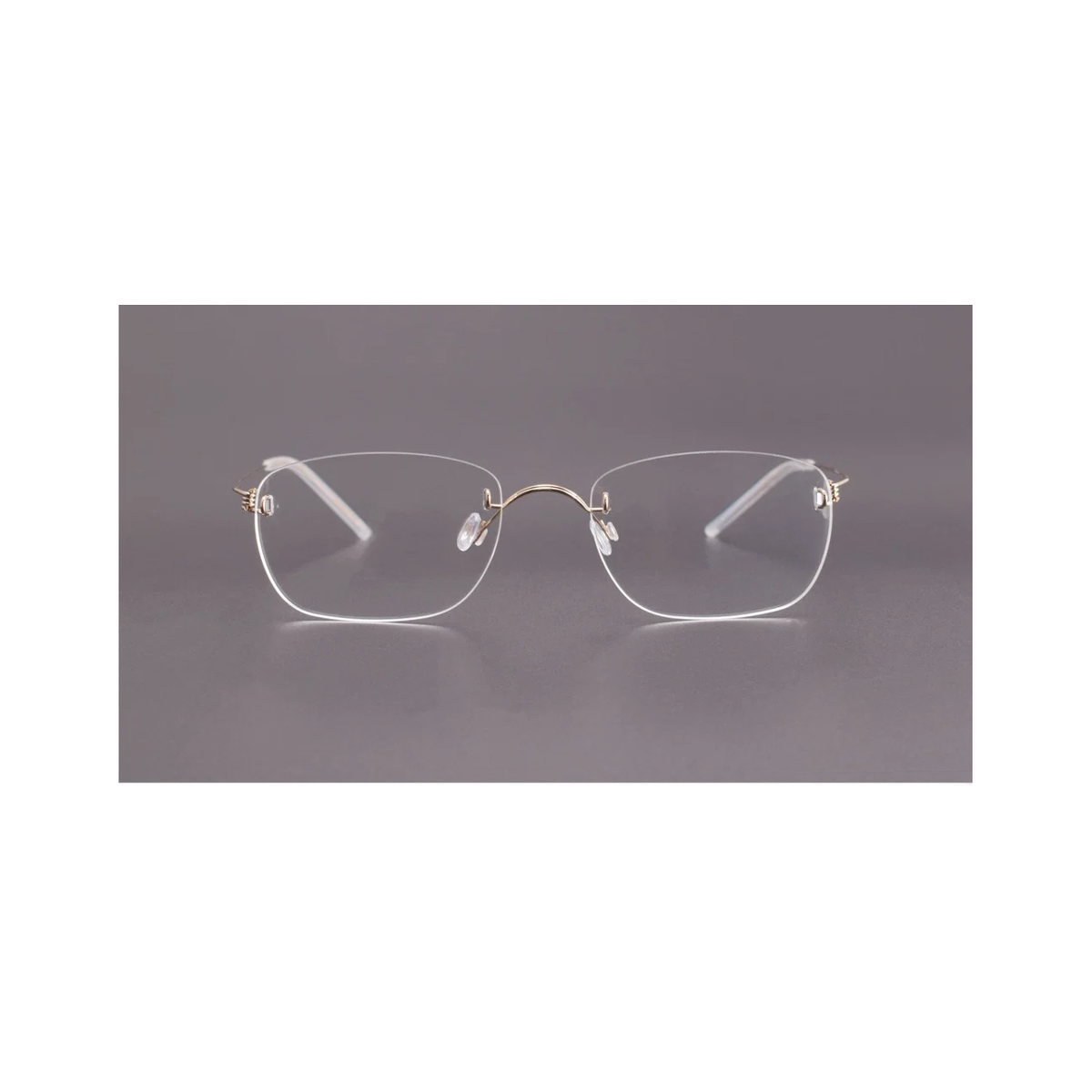 Gold men's titanium rimless spring-hinge glasses, front product view