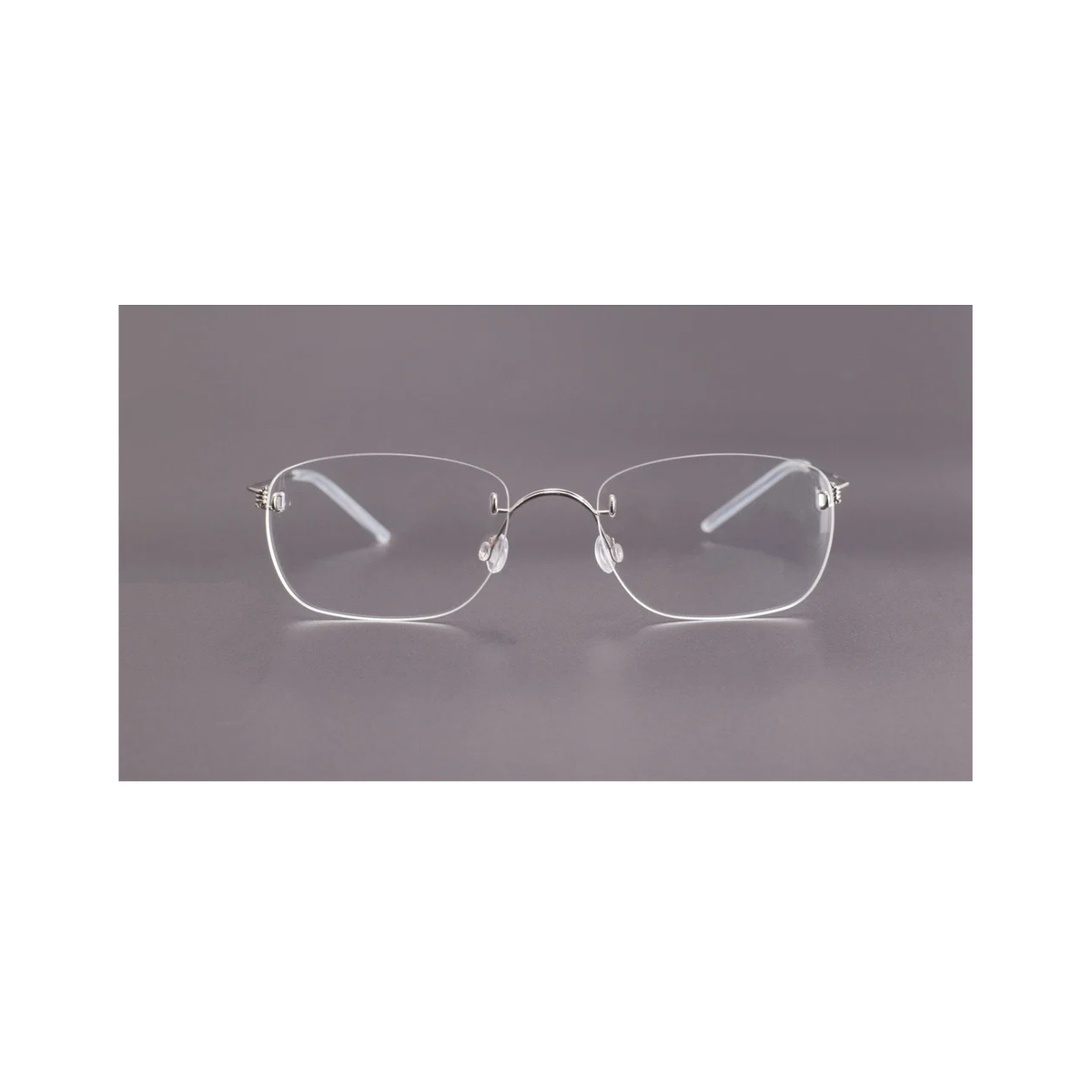 Silver men's titanium rimless spring-hinge glasses, front product view