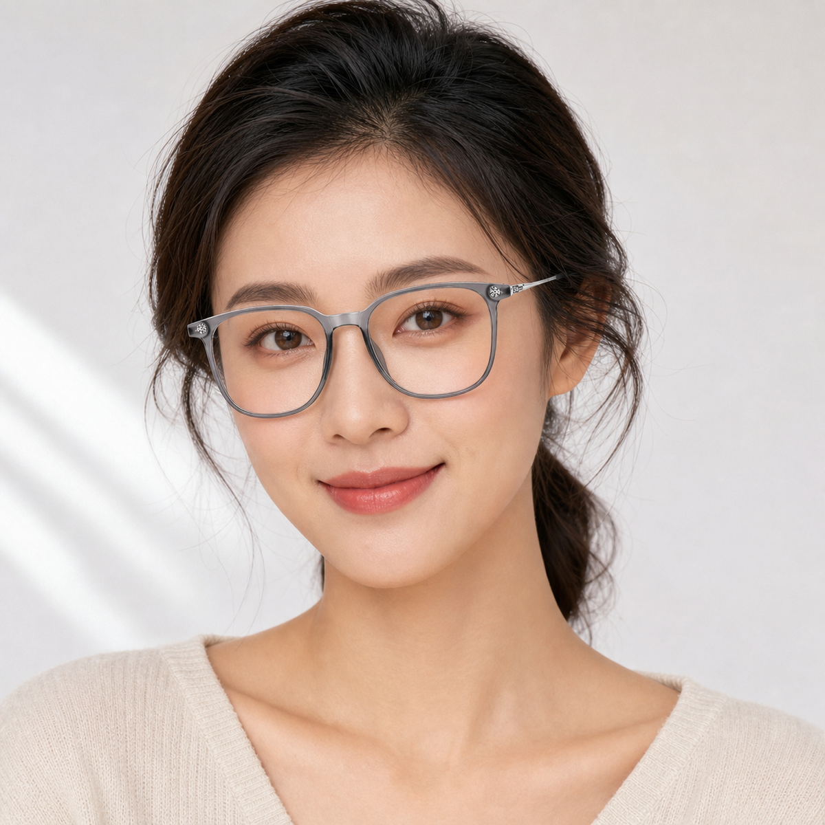Silver Gray eyeglass frame worn by an adult model, view 1
