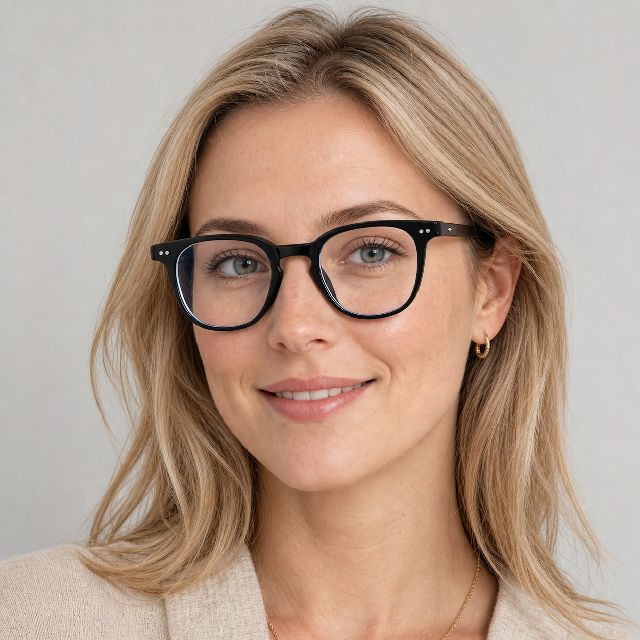 Glossy Black eyeglass frame worn by an adult model, view 1