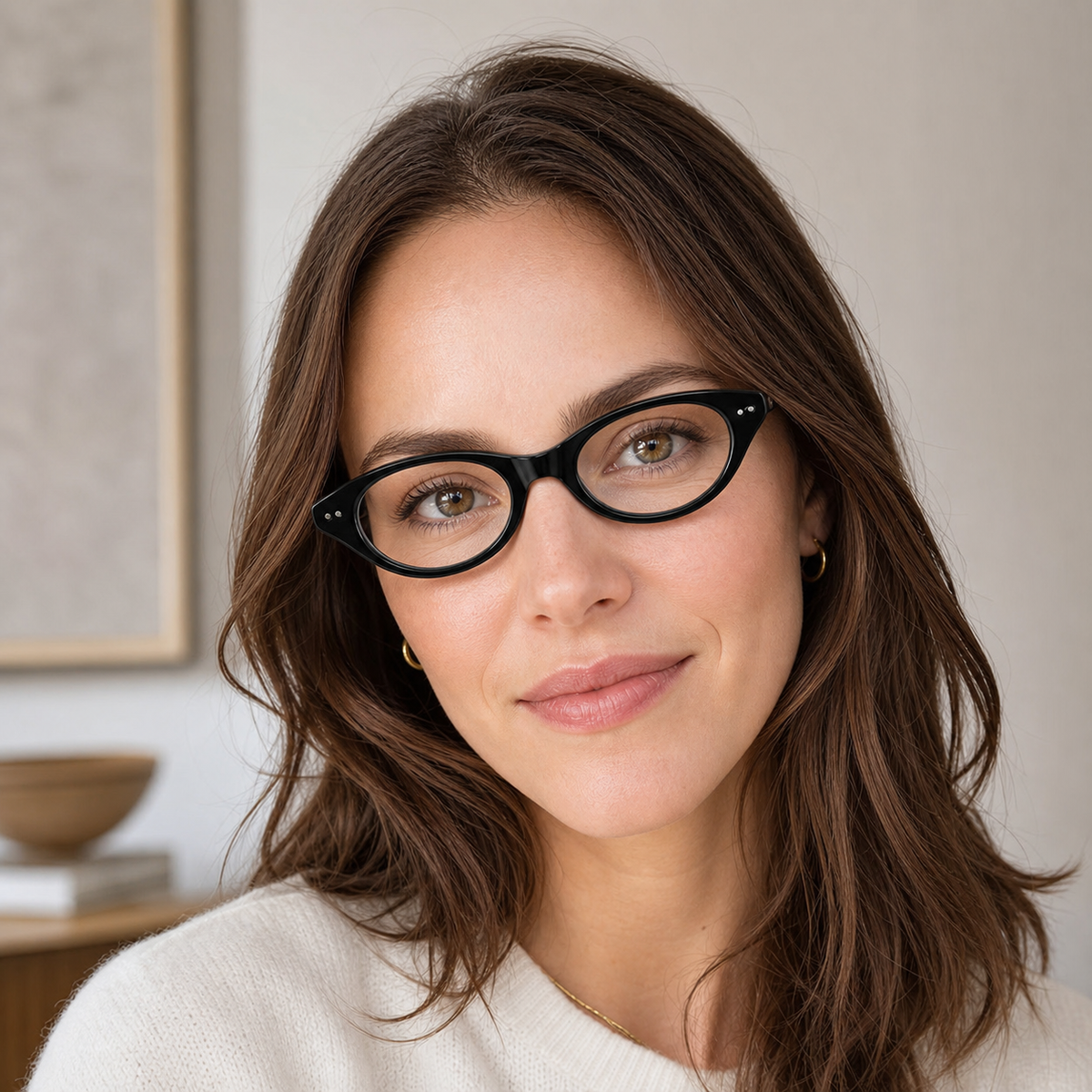 Glossy Black small oval full-rim glasses worn by an adult White woman