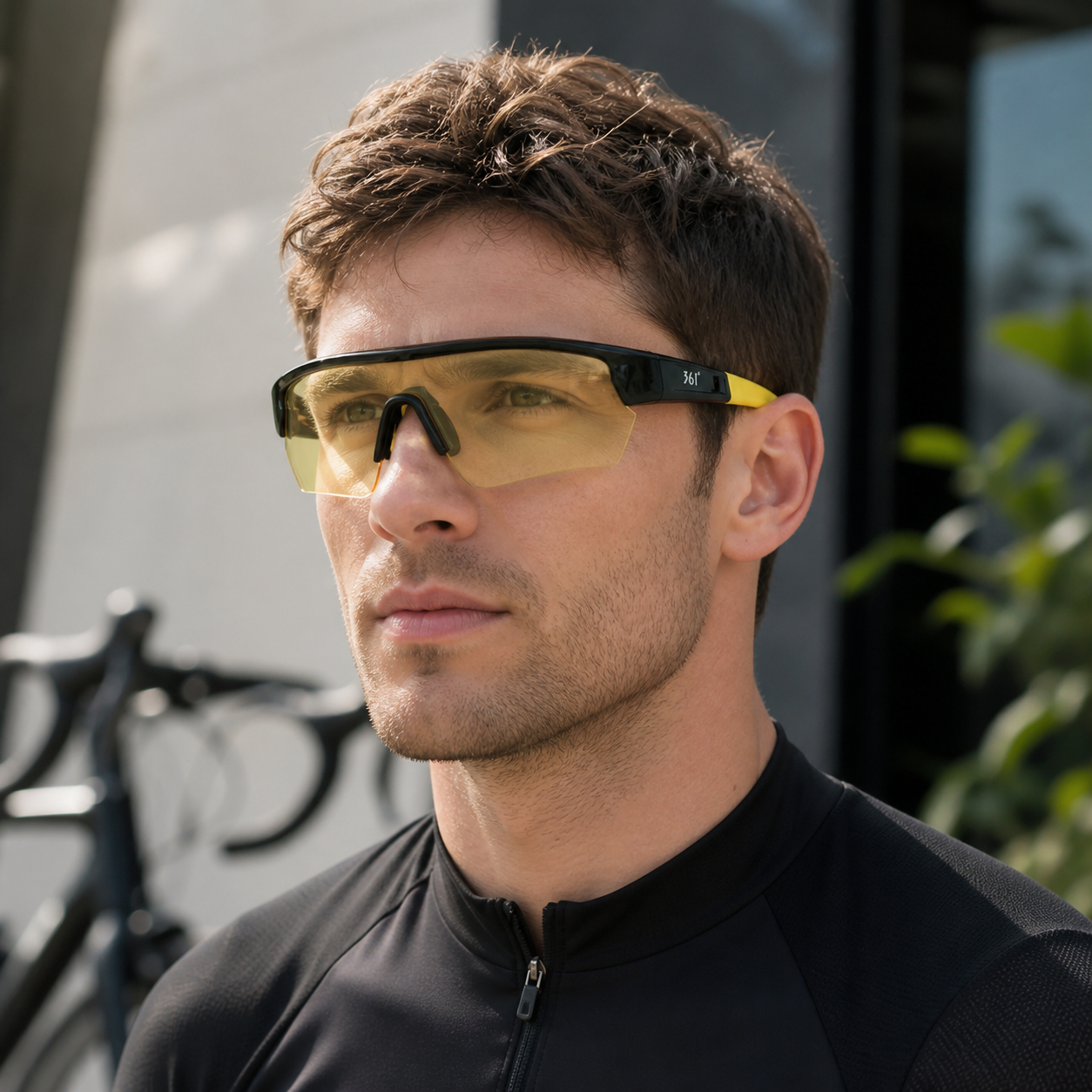 Black and yellow semi-rimless TR shield sports sunglasses worn by an adult White man