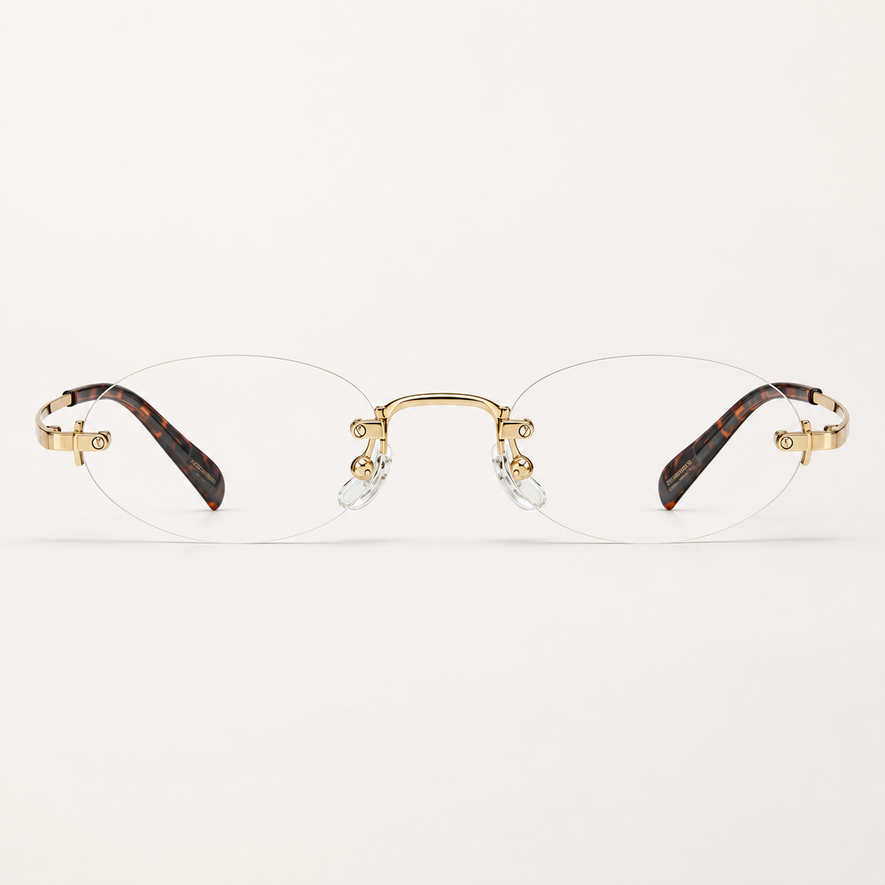 Gold/Leopard women's titanium rimless narrow oval glasses, front product view
