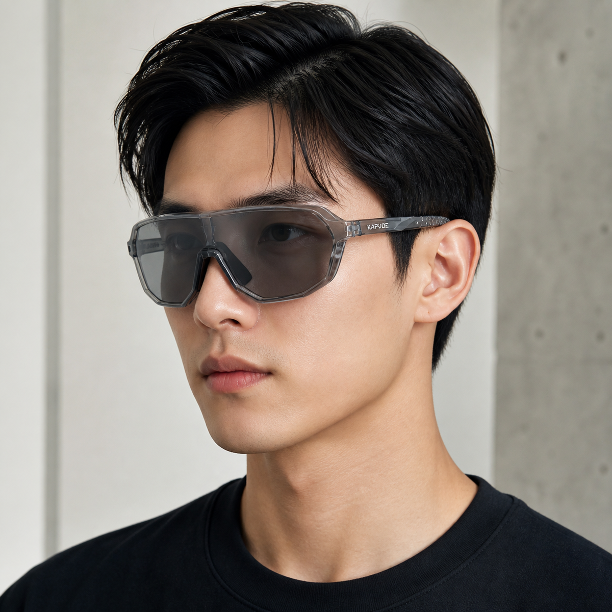 Crystal Grey Frame/Photochromic Grey Lens eyewear, worn by an adult model, front fit