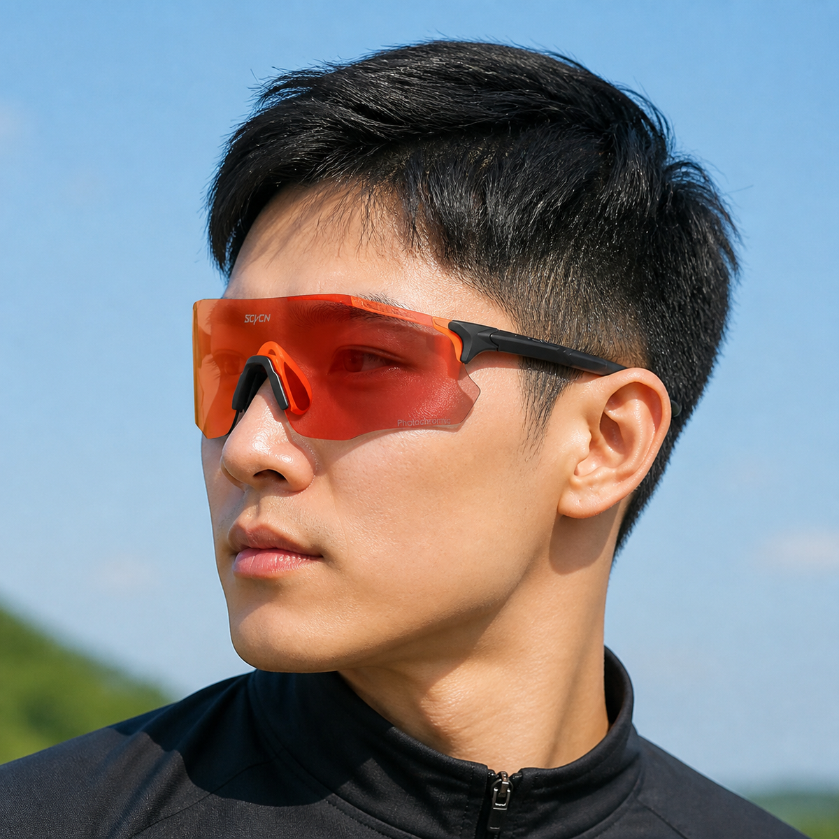 Matte Black Frame/Photochromic Red Lens eyewear, worn by an adult model, front fit