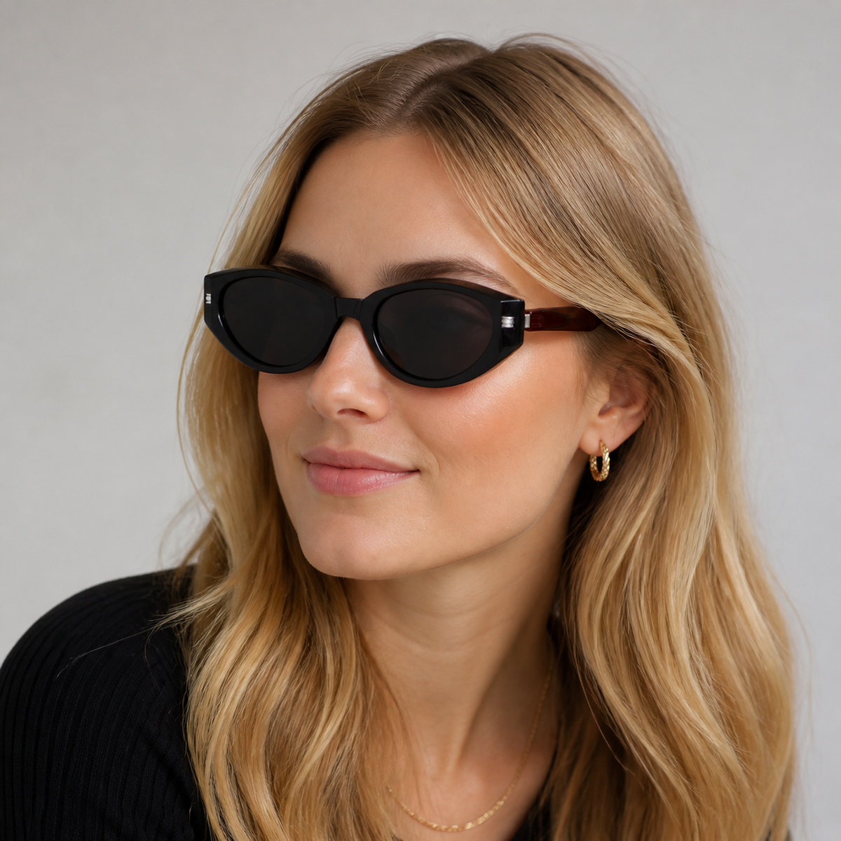 Black Women's Foldable Polarised Cat-Eye Sunglasses, worn by an adult model, alternate fit