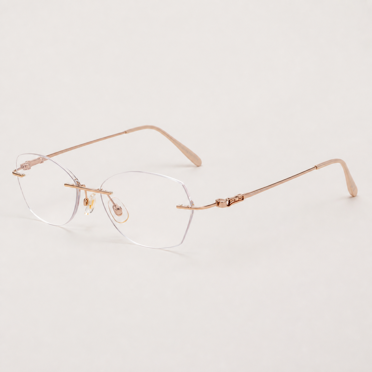 Gold women's titanium alloy rimless soft geometric glasses, 45-degree product view