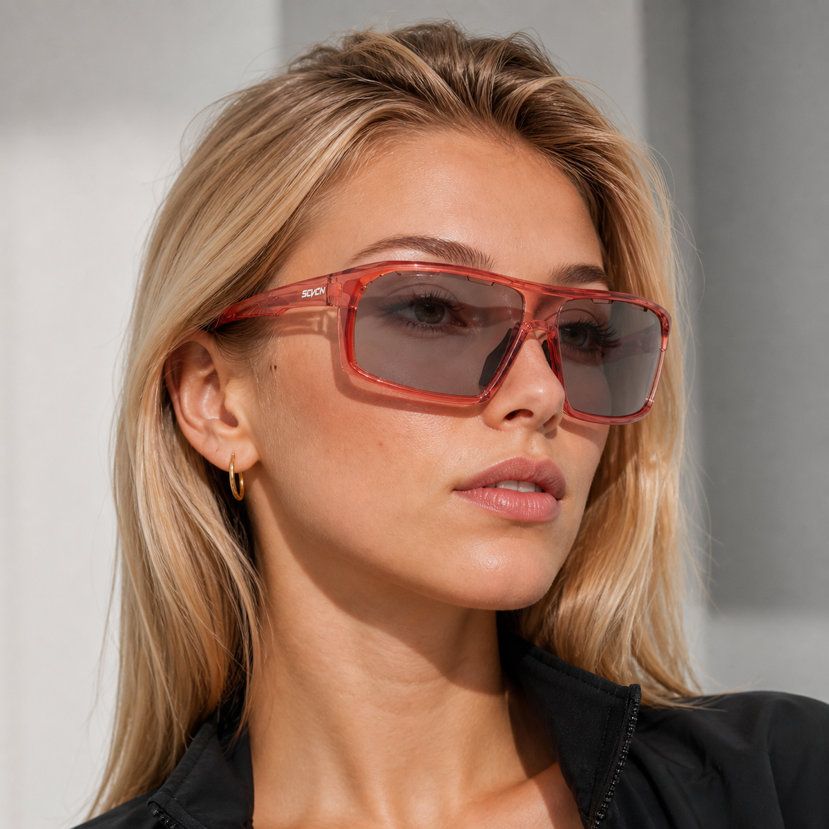 Glossy Crystal Pink Frame/Photochromic Grey Lens eyewear, worn by an adult model, alternate fit