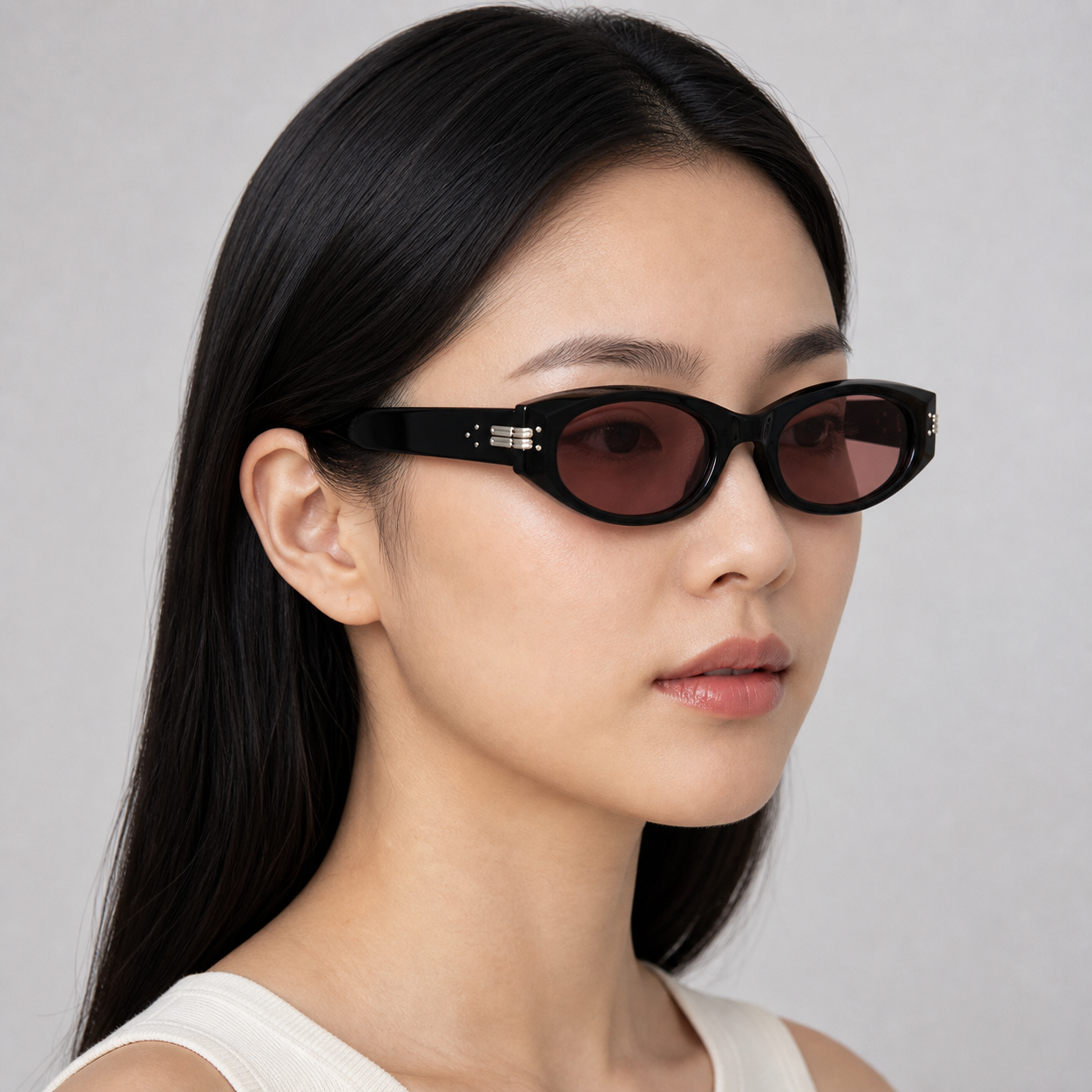 Women’s Black & Red sunglasses worn by an adult East Asian woman