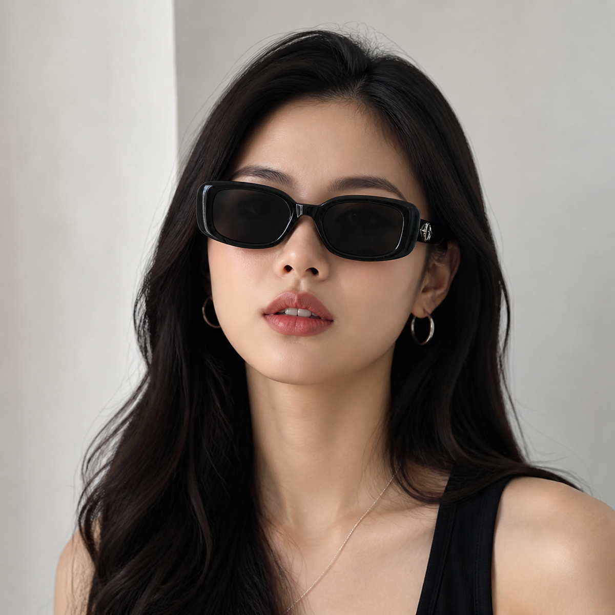 Black Women's Polycarbonate Narrow Rectangle Sunglasses, worn by an adult model, front fit