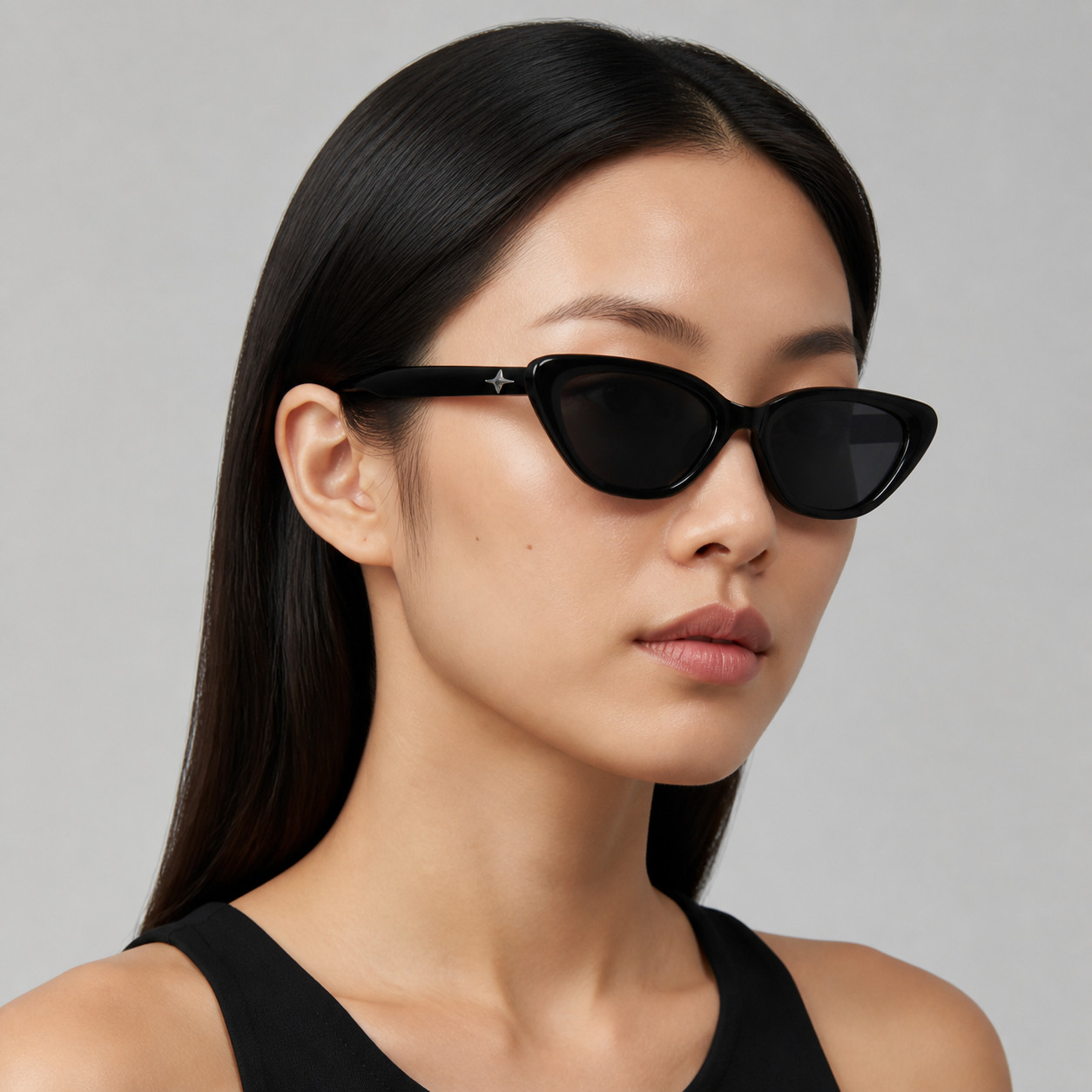 Women’s Black sunglasses worn by an adult East Asian woman
