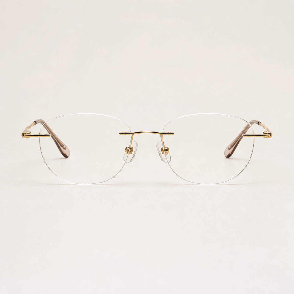 Gold titanium rimless round eyeglasses, straight-on product view