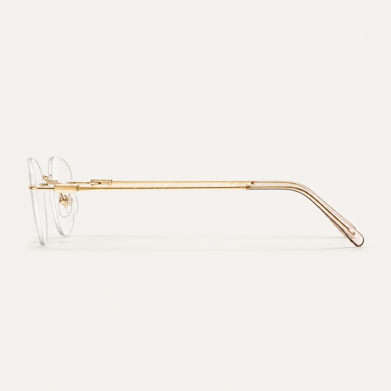 Gold titanium rimless round eyeglasses, side-profile product view
