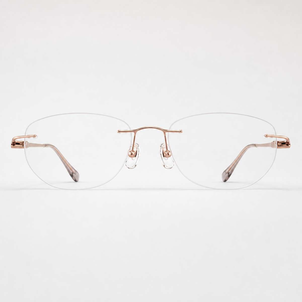 Rose Gold titanium rimless round eyeglasses, straight-on product view
