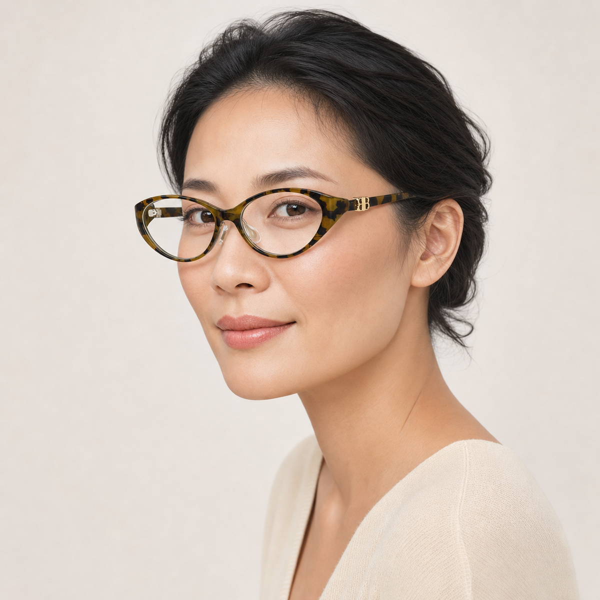 Tortoise Shell women's retro TR90 oval cat-eye full-rim glasses worn by an adult Mature East Asian Woman