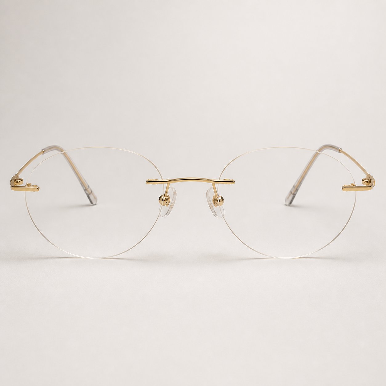 Gold titanium rimless oval eyeglasses, straight-on product view