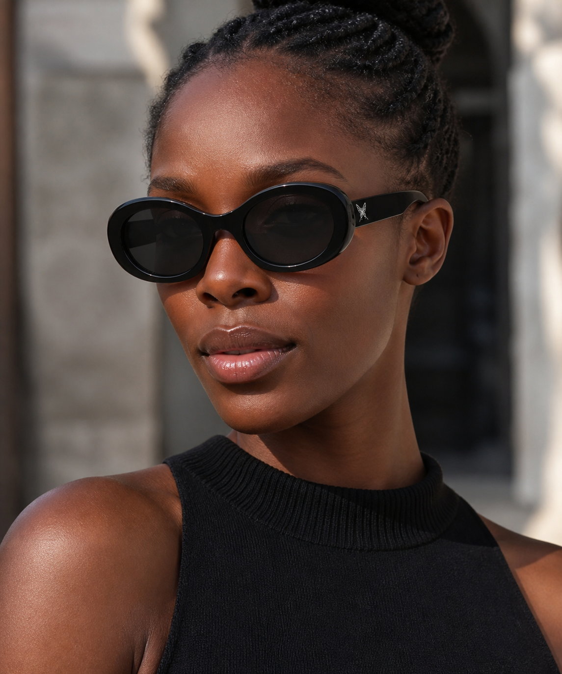 Women’s Black full-rim oval cat-eye sunglasses, three-quarter adult model fit